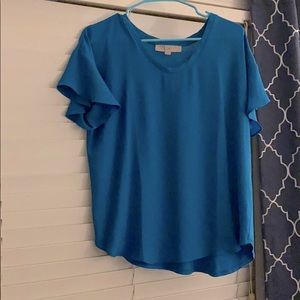 Blue shirt with ruffled sleeves